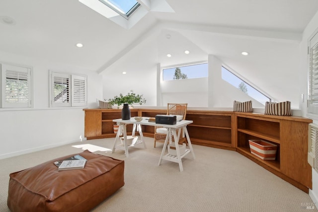 office space with recessed lighting, lofted ceiling with skylight, and light colored carpet