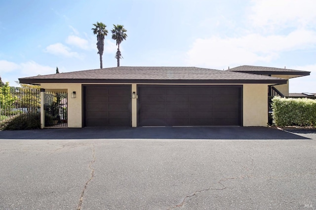 garage featuring fence