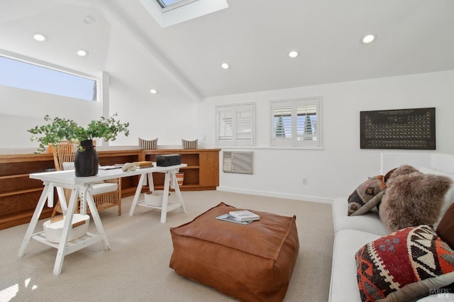 office area with light colored carpet, plenty of natural light, recessed lighting, and vaulted ceiling with skylight