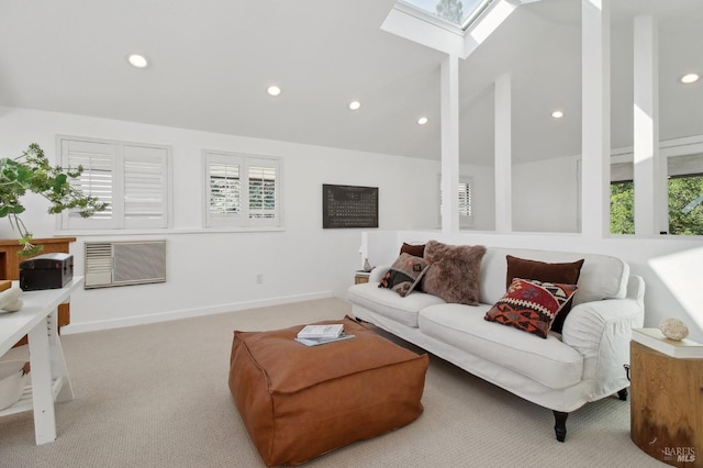 living room with visible vents, baseboards, lofted ceiling with skylight, carpet, and recessed lighting
