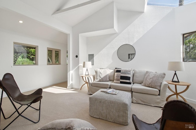 carpeted living room featuring baseboards, vaulted ceiling, and recessed lighting