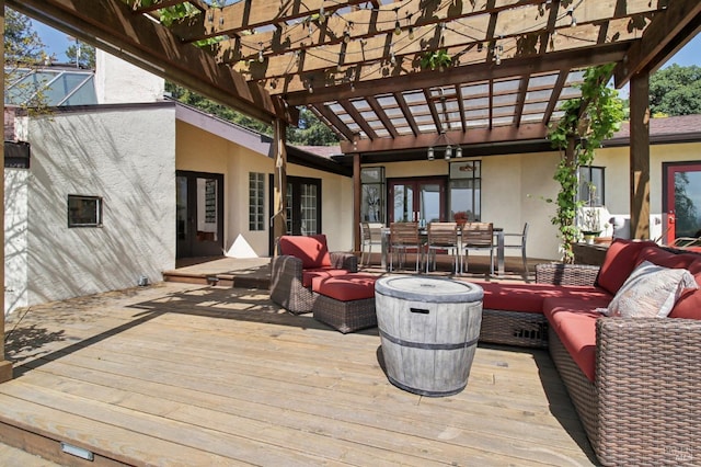 wooden terrace featuring french doors, a pergola, outdoor dining area, and outdoor lounge area