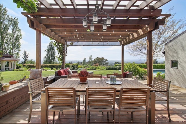view of patio / terrace featuring a pergola, a deck, and outdoor dining space
