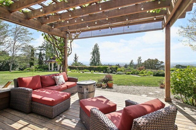 deck featuring a lawn, a pergola, and an outdoor hangout area