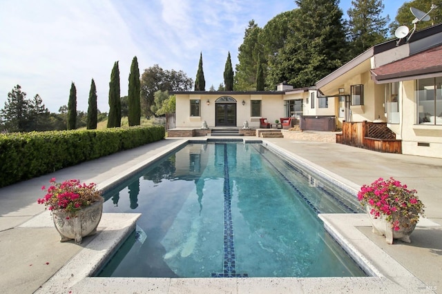 outdoor pool featuring a patio