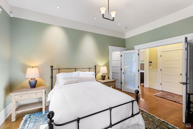 bedroom featuring wood finished floors