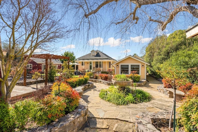 back of house with a pergola