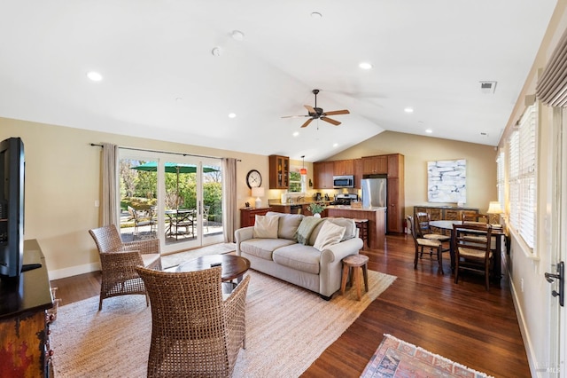 living area featuring visible vents, baseboards, ceiling fan, dark wood-type flooring, and vaulted ceiling