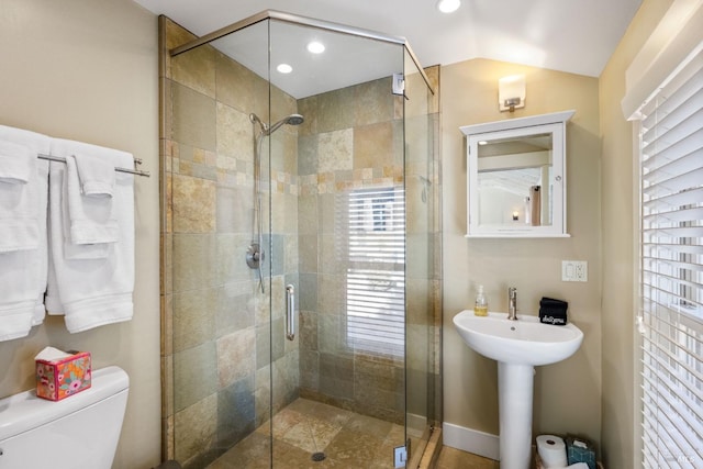 full bathroom with toilet, recessed lighting, baseboards, a shower stall, and lofted ceiling