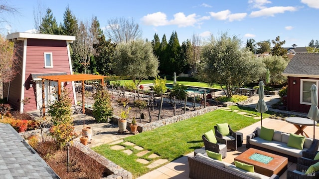 view of yard with an outdoor living space and a patio area