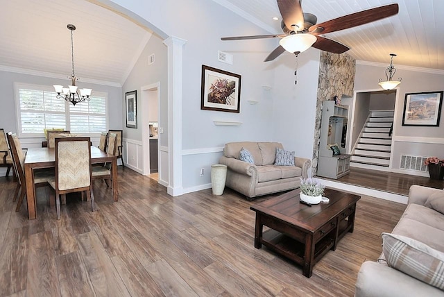 living area with arched walkways, visible vents, lofted ceiling, and ceiling fan with notable chandelier