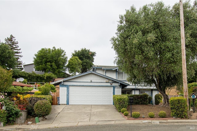 view of front facade with a garage and concrete driveway