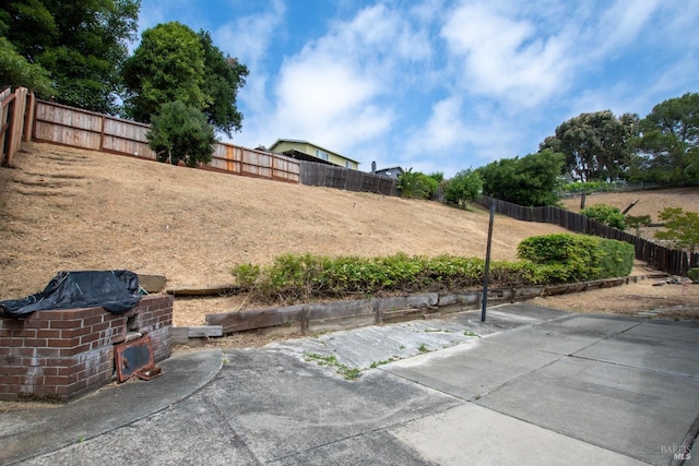 view of yard featuring a patio area and fence