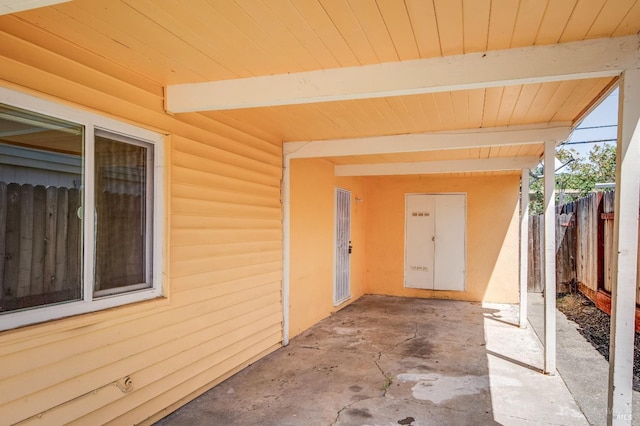view of patio featuring fence