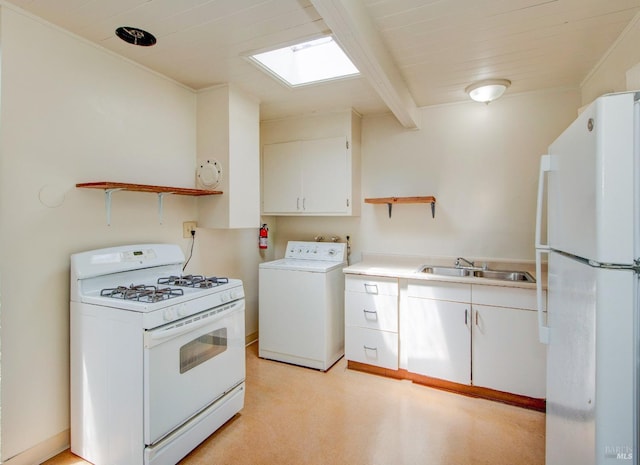 kitchen with white appliances, white cabinetry, washer / clothes dryer, and open shelves