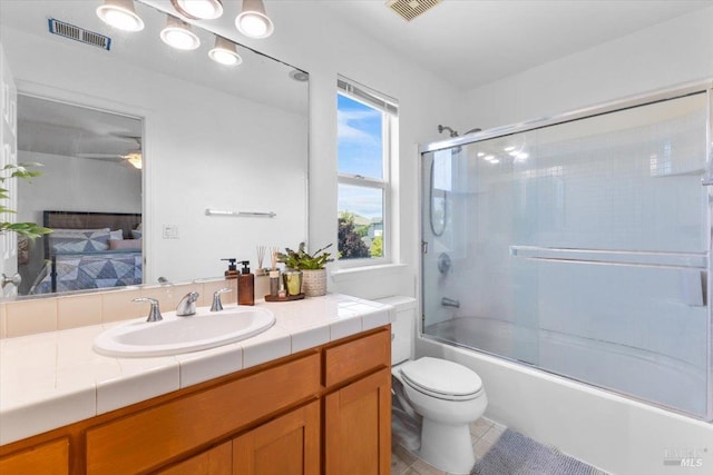 bathroom with vanity, ensuite bathroom, toilet, and visible vents