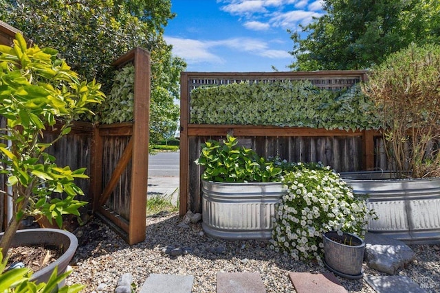 view of gate with fence