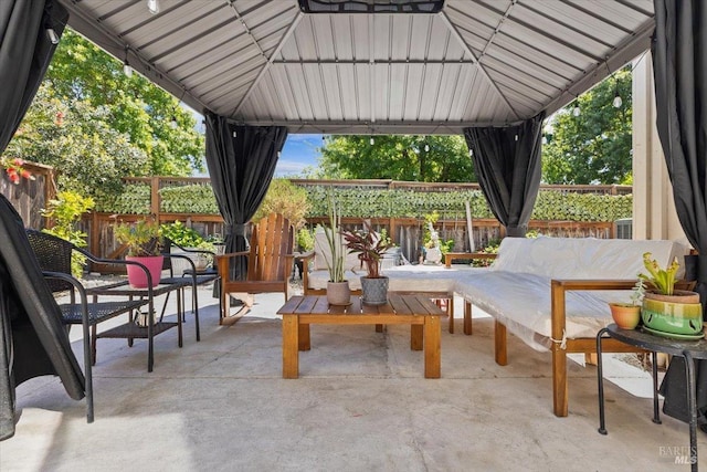 view of patio / terrace with a gazebo and fence private yard