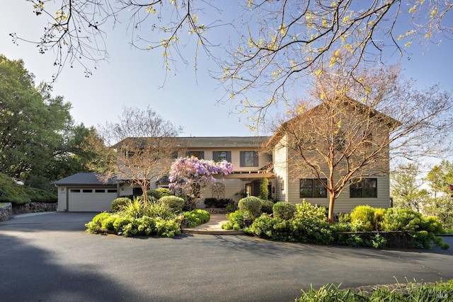 view of front of property featuring an attached garage and driveway