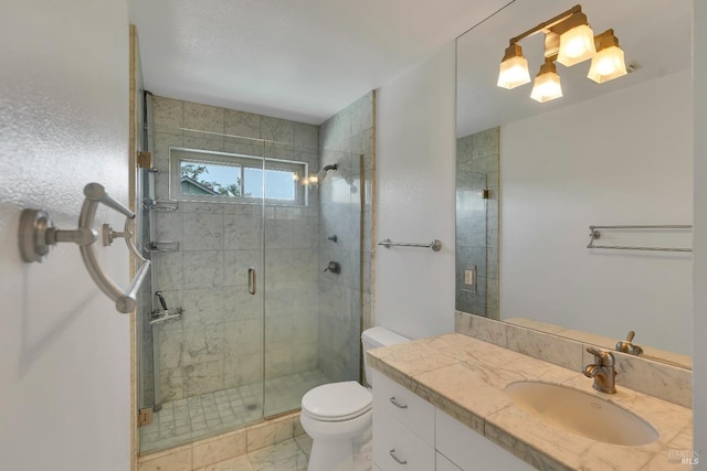 full bathroom with vanity, a stall shower, toilet, and marble finish floor