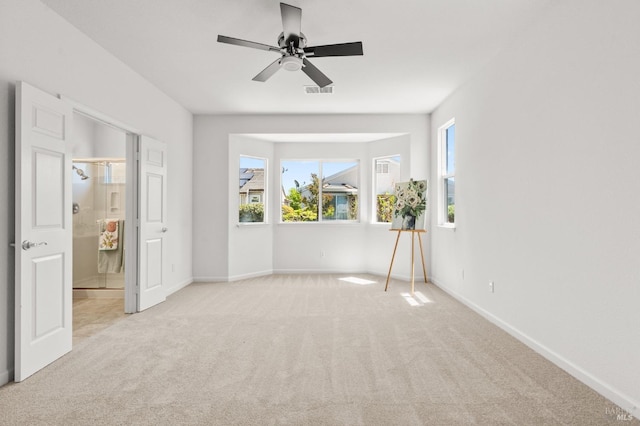 943 Bridgeport Way, Rio Vista, CA 94571 - unfurnished bedroom with baseboards, ceiling fan, ensuite bathroom, and carpet