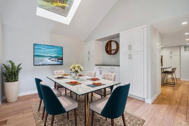 269 Corte Madera Ave, Mill Valley, CA 94941 - dining room with light wood-style floors, a skylight, baseboards, recessed lighting, and high vaulted ceiling