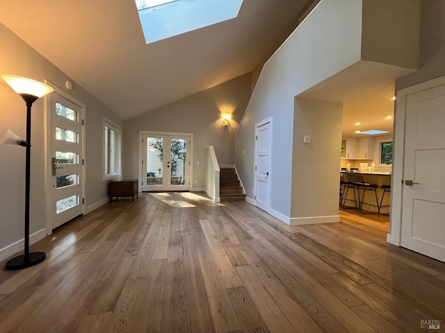 269 Corte Madera Ave, Mill Valley, CA 94941 - unfurnished living room featuring hardwood / wood-style floors, stairs, french doors, high vaulted ceiling, and baseboards