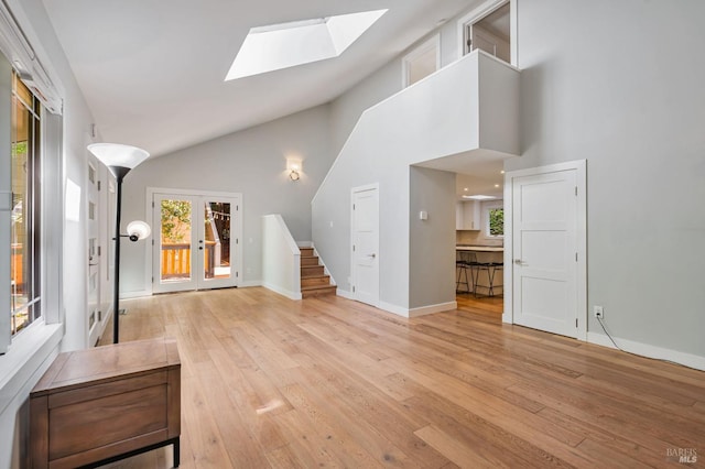 269 Corte Madera Ave, Mill Valley, CA 94941 - foyer with a skylight, stairs, light wood finished floors, french doors, and high vaulted ceiling