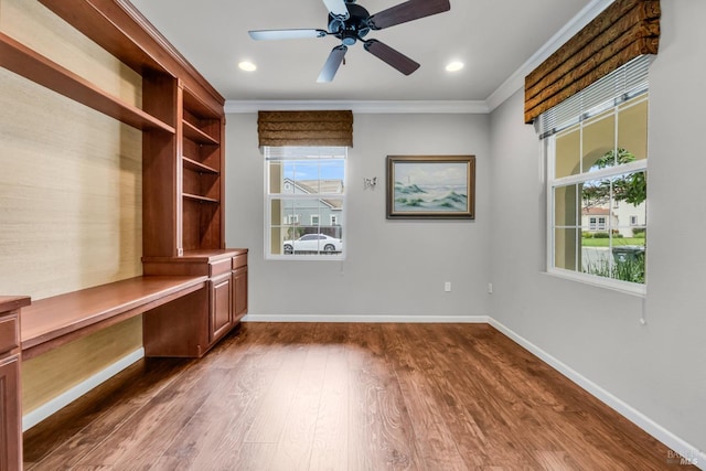 59 Toscana Dr, American Canyon, CA 94503 - mudroom with built in desk, ornamental molding, dark wood finished floors, baseboards, and ceiling fan