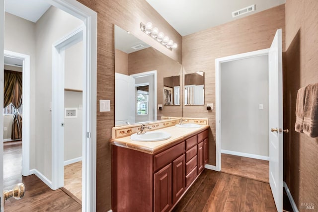 59 Toscana Dr, American Canyon, CA 94503 - full bathroom featuring wood finished floors, double vanity, and baseboards