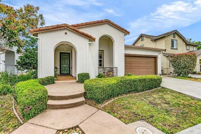 59 Toscana Dr, American Canyon, CA 94503 - mediterranean / spanish home featuring driveway, a garage, stucco siding, and a tiled roof