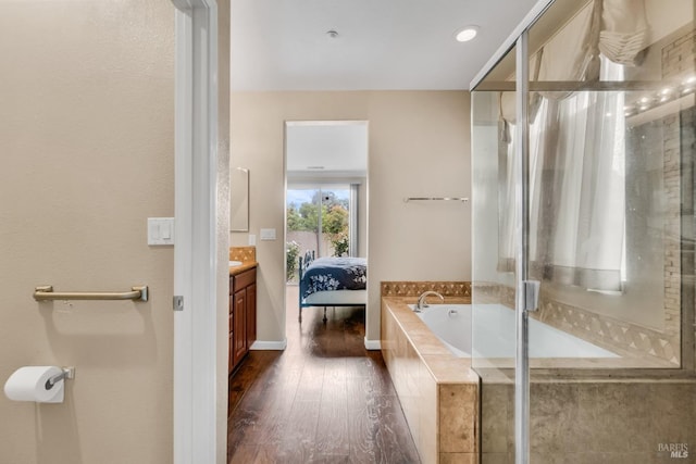 59 Toscana Dr, American Canyon, CA 94503 - bathroom featuring vanity, wood finished floors, a bath, and a stall shower
