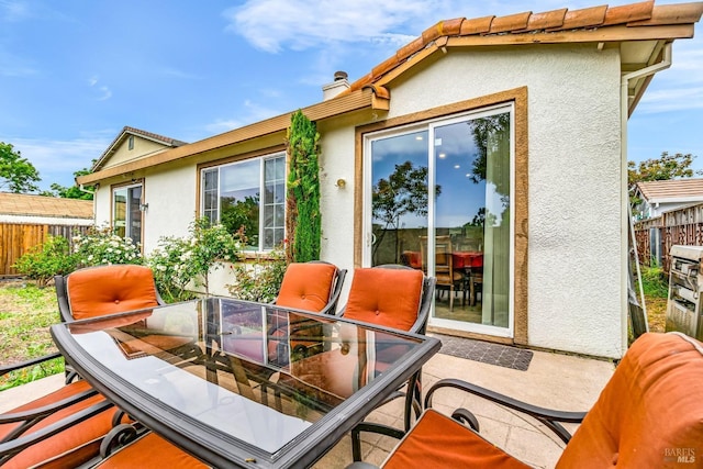59 Toscana Dr, American Canyon, CA 94503 - rear view of house with outdoor dining space, fence, stucco siding, and a chimney