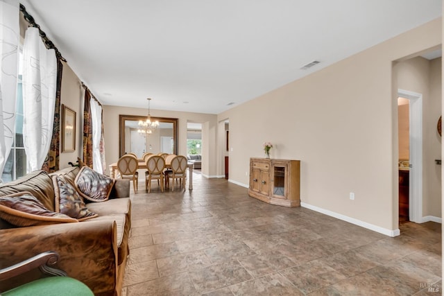 59 Toscana Dr, American Canyon, CA 94503 - living room with a chandelier, baseboards, and light stone finish floors