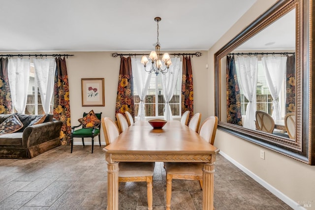 59 Toscana Dr, American Canyon, CA 94503 - dining area with a chandelier, healthy amount of natural light, baseboards, and stone finish floors