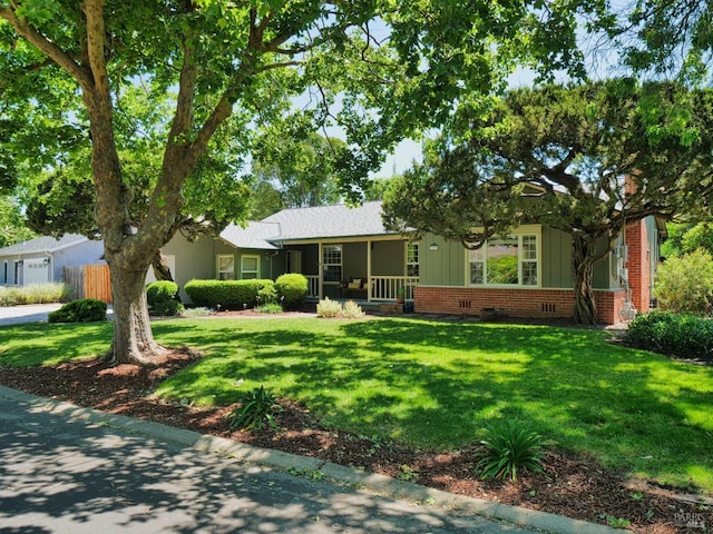 ranch-style home with brick siding and board and batten siding