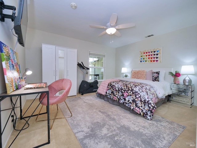 carpeted bedroom with a closet and ceiling fan