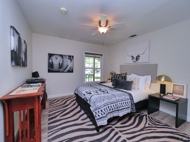 bedroom with baseboards and ceiling fan