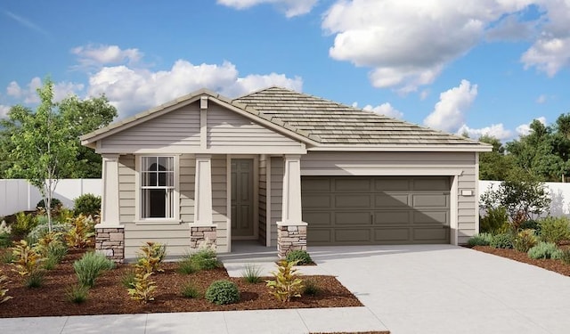 view of front facade with an attached garage, fence, and concrete driveway