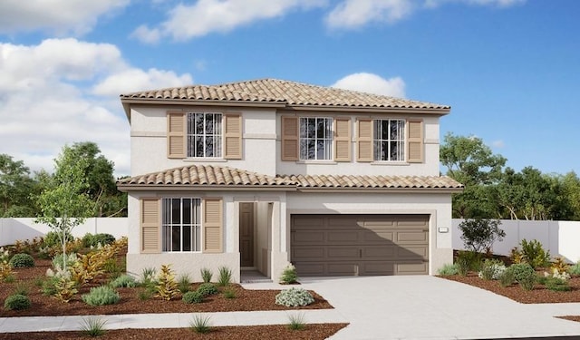 mediterranean / spanish house with fence, a garage, stucco siding, concrete driveway, and a tiled roof