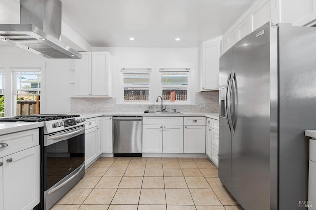 kitchen featuring a sink, backsplash, wall chimney range hood, and stainless steel appliances