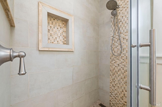 full bath featuring a shower stall