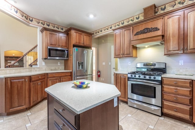 35600 Rock Creek Rd, Shingletown, CA 96088 - kitchen featuring custom exhaust hood, a center island, brown cabinets, light tile patterned floors, and stainless steel appliances