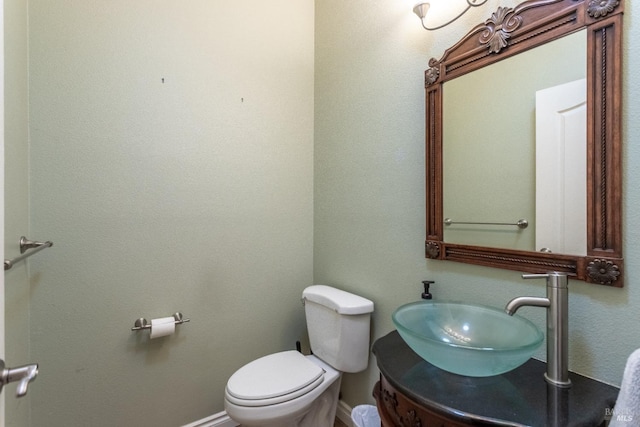35600 Rock Creek Rd, Shingletown, CA 96088 - half bathroom featuring vanity, baseboards, and toilet