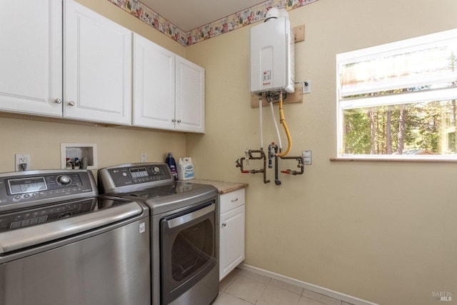 35600 Rock Creek Rd, Shingletown, CA 96088 - washroom featuring light tile patterned flooring, baseboards, washing machine and clothes dryer, cabinet space, and water heater