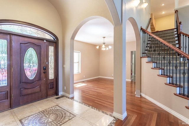 35600 Rock Creek Rd, Shingletown, CA 96088 - foyer entrance with stairway, arched walkways, baseboards, and a chandelier
