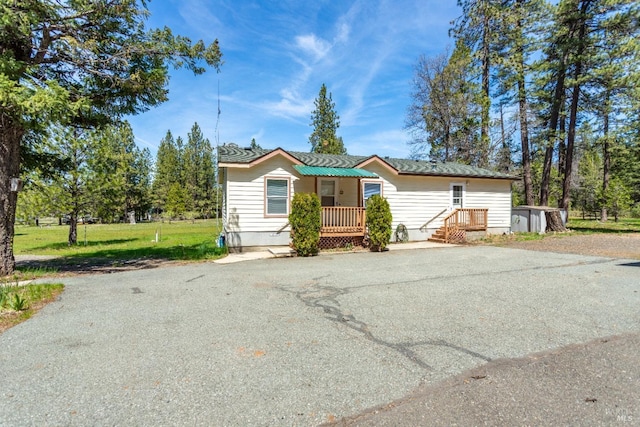 35600 Rock Creek Rd, Shingletown, CA 96088 - manufactured / mobile home with crawl space, a front yard, and aphalt driveway