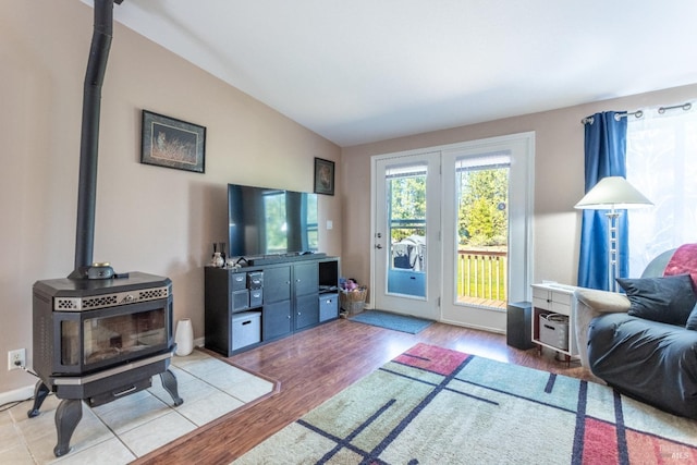 35600 Rock Creek Rd, Shingletown, CA 96088 - living area with a wood stove, wood finished floors, and vaulted ceiling
