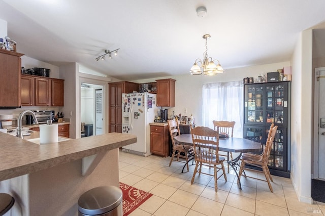 35600 Rock Creek Rd, Shingletown, CA 96088 - dining room with an inviting chandelier, lofted ceiling, light tile patterned floors, and track lighting