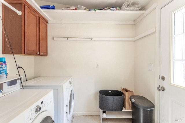 35600 Rock Creek Rd, Shingletown, CA 96088 - laundry area with cabinet space, light tile patterned flooring, plenty of natural light, and washer and clothes dryer